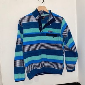 blue and green Patagonia button up sweater